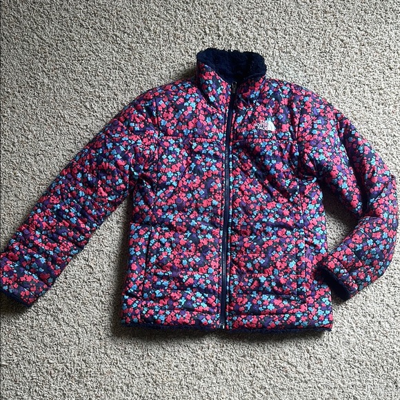 The North Face Floral Puffer Jacket with fuzzy soft reversible Navy Blue side
